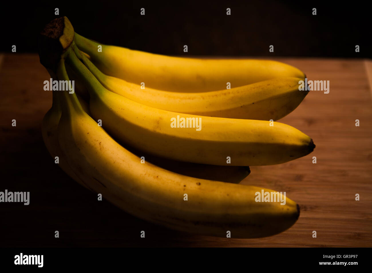 Yellow Banana on wood board Stock Photo