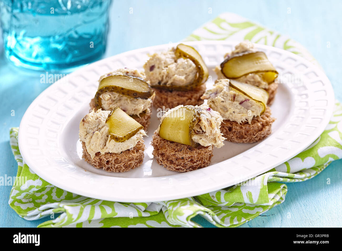 Canapes with fish pate and pickle. Party food Stock Photo Alamy
