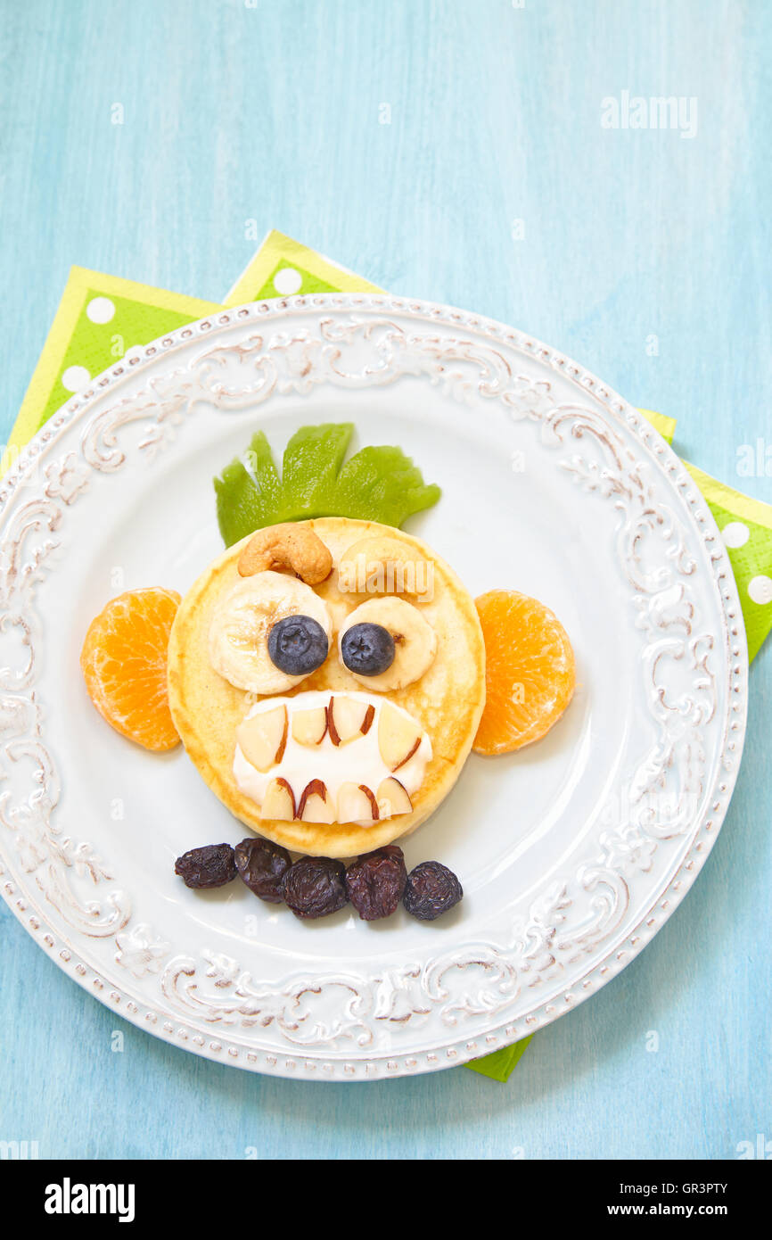 Funny Halloween pancake with scary monkey face Stock Photo Alamy