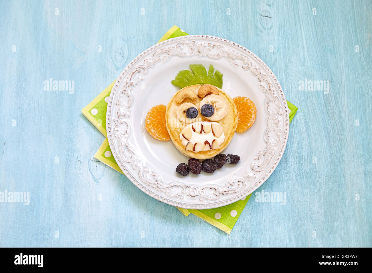 Funny Halloween pancake with scary monkey face Stock Photo Alamy
