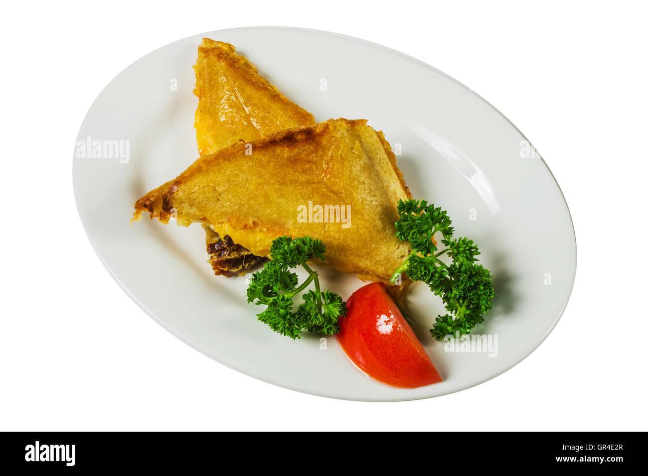 Sandwiches on a plate with tomato and herbs Stock Photo