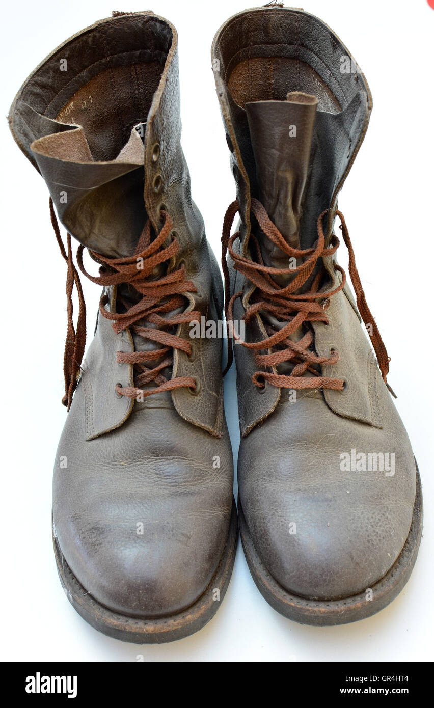 Dirty old boots isolated on white background military style. Dirty old ...