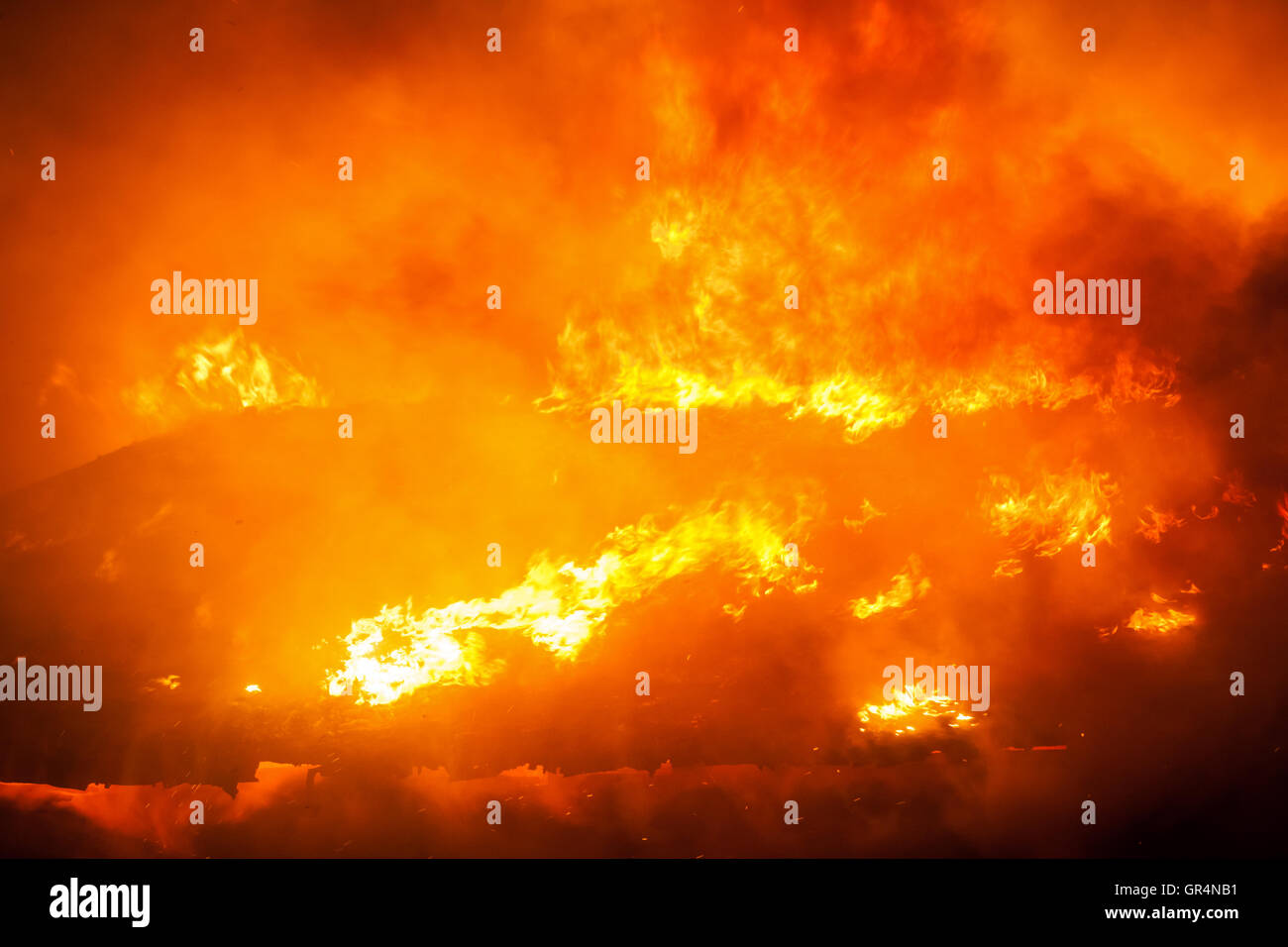Burning fire flame on wooden house roof Stock Photo Alamy