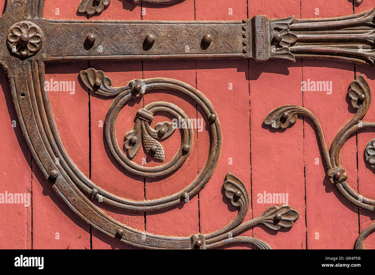 An ornate detail of a church door Stock Photo