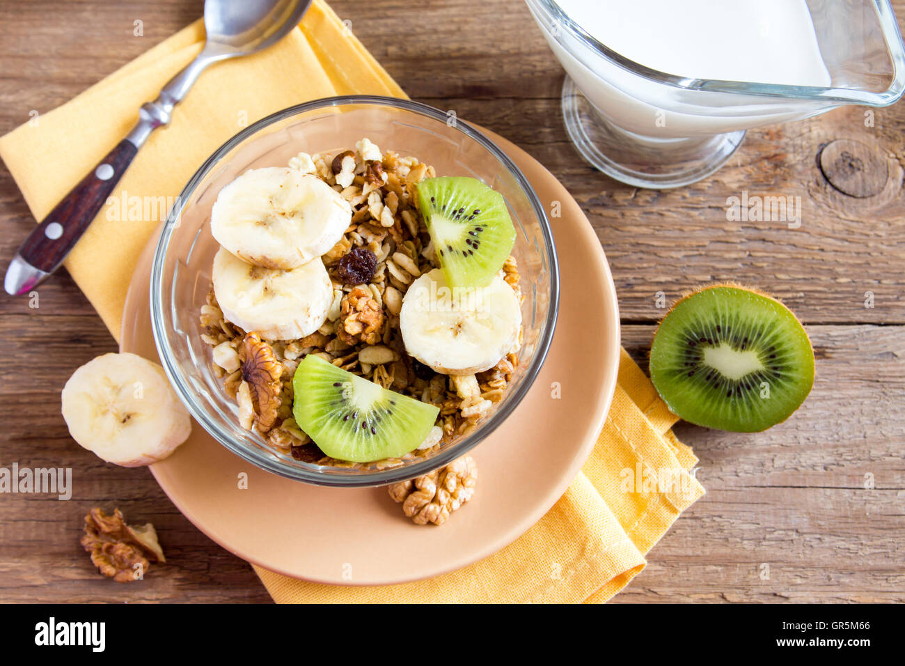 Homemade granola with fruits (banana, kiwi) and nuts for healthy
