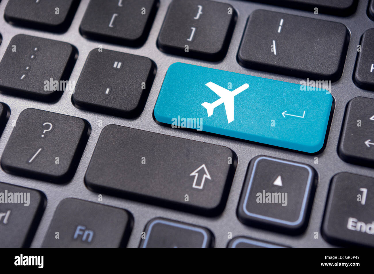 online booking of flight ticket, with plane sign on keyboard Stock Photo