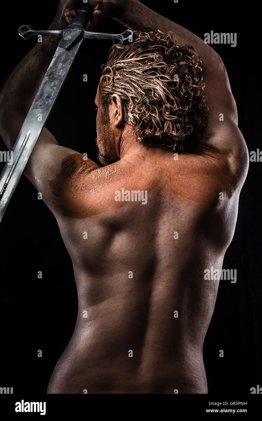 Warrior with sword, Dream, Anger, Dreaming, man covered in mud, Stock Photo...