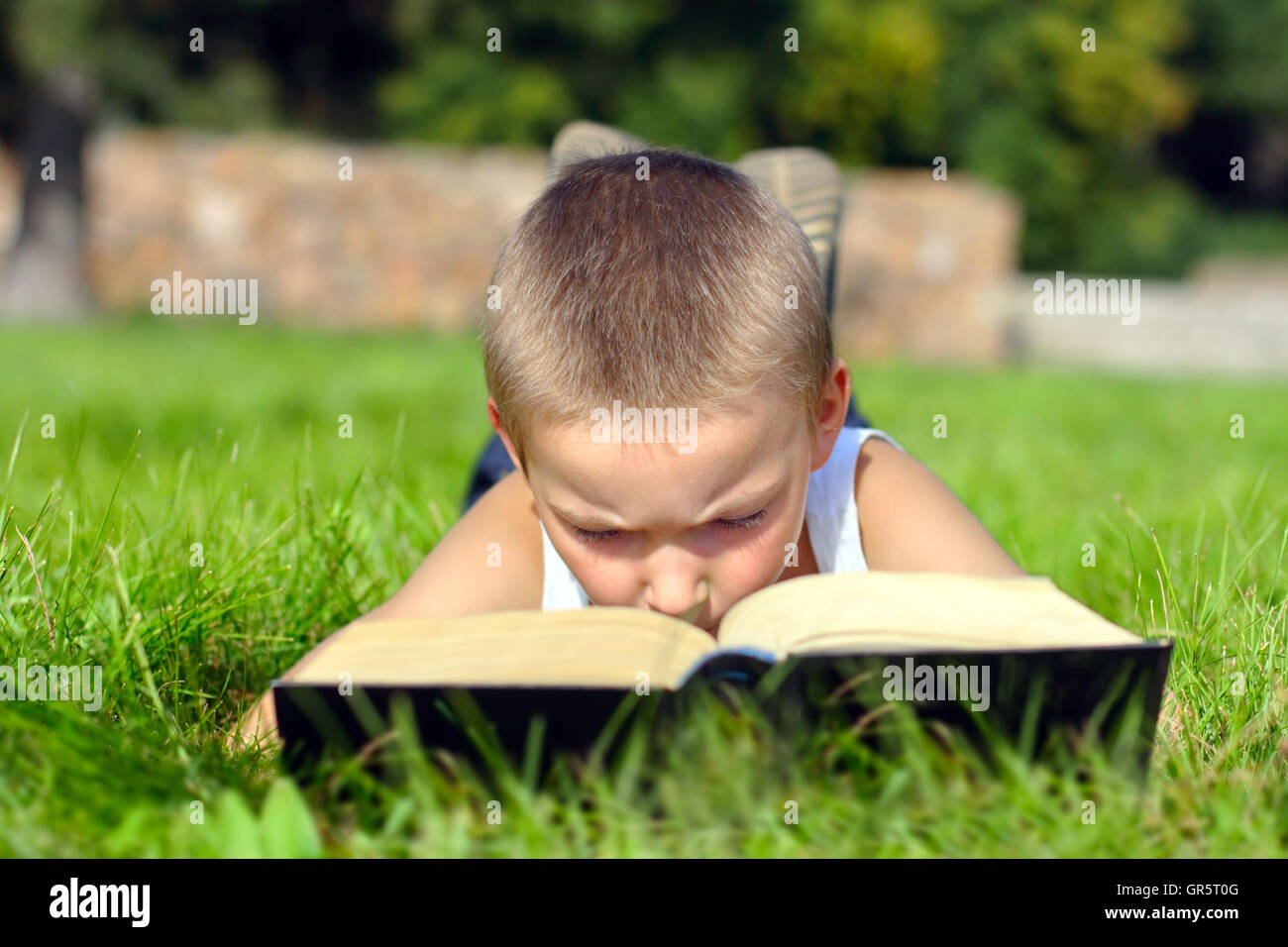 child reads book Stock Photo Alamy