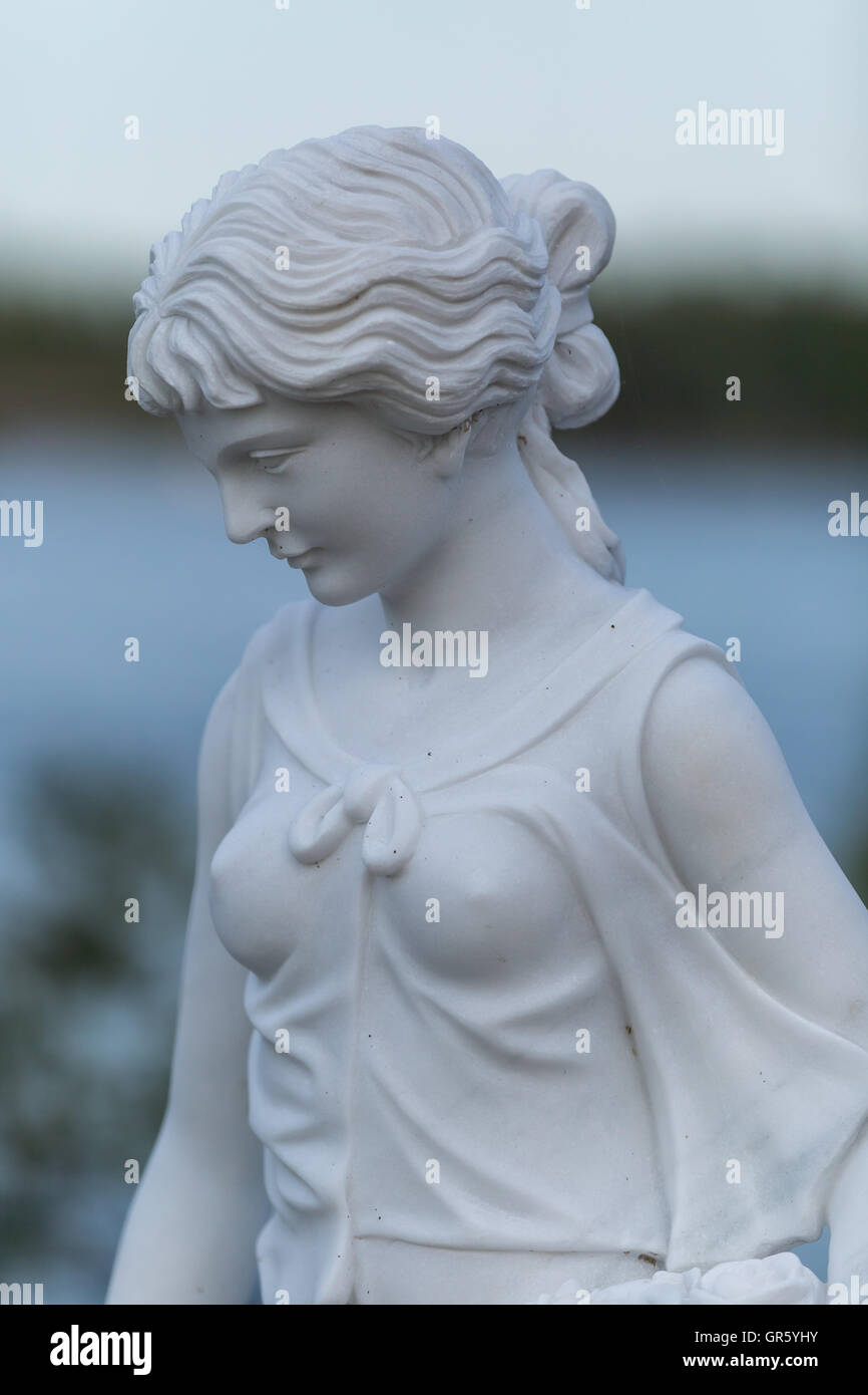 Statue of a beautiful woman in summer Stock Photo - Alamy