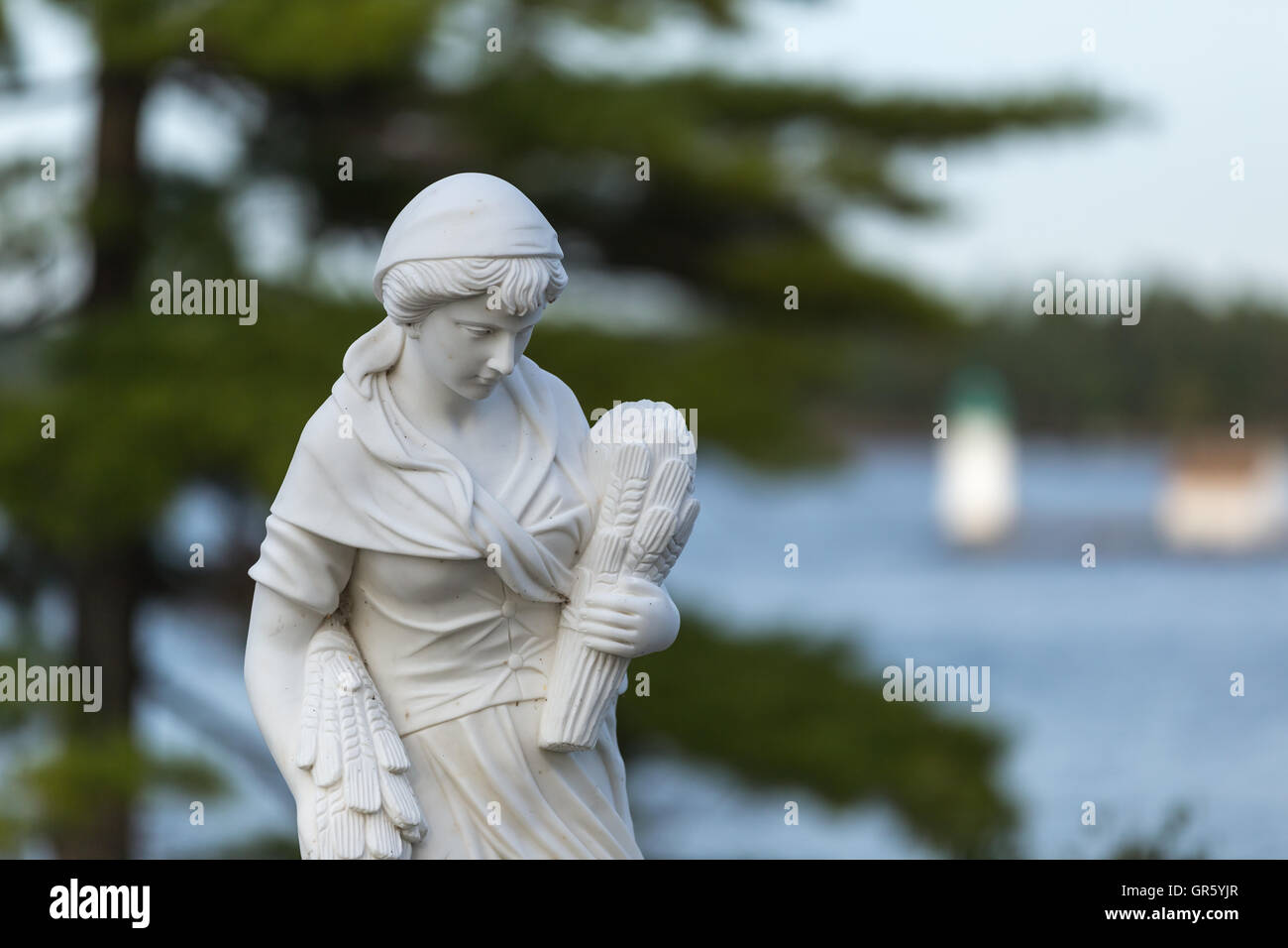 Statue of a beautiful woman in summer Stock Photo - Alamy