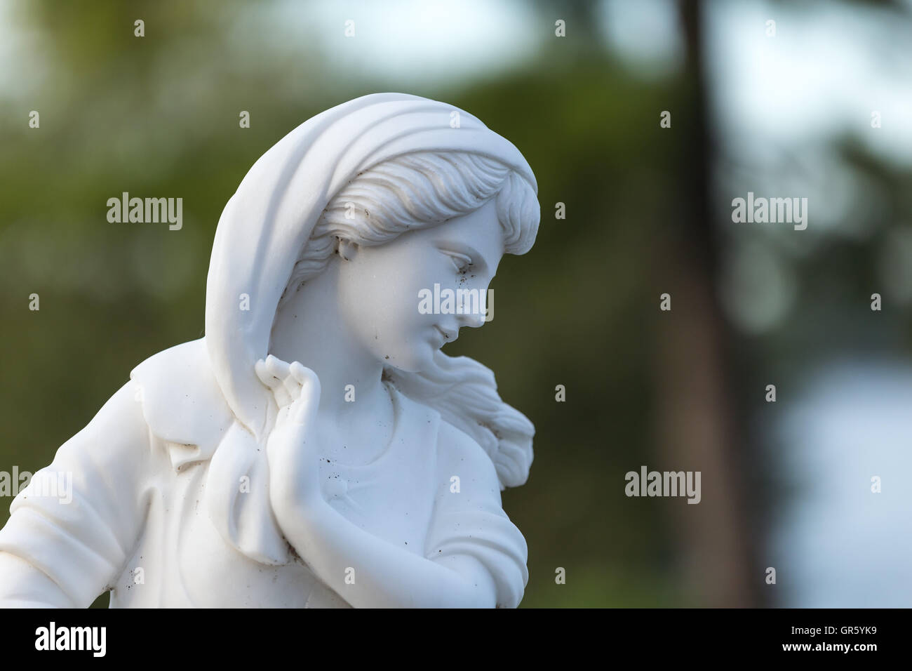 Statue of a beautiful woman in summer Stock Photo - Alamy