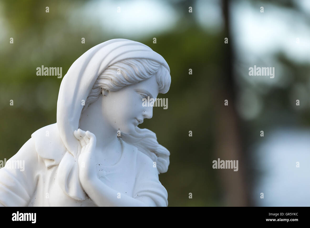 Statue of a beautiful woman in summer Stock Photo - Alamy
