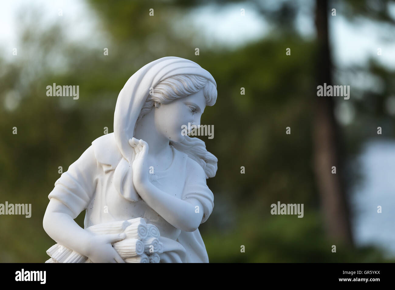 Statue of a beautiful woman in summer Stock Photo - Alamy