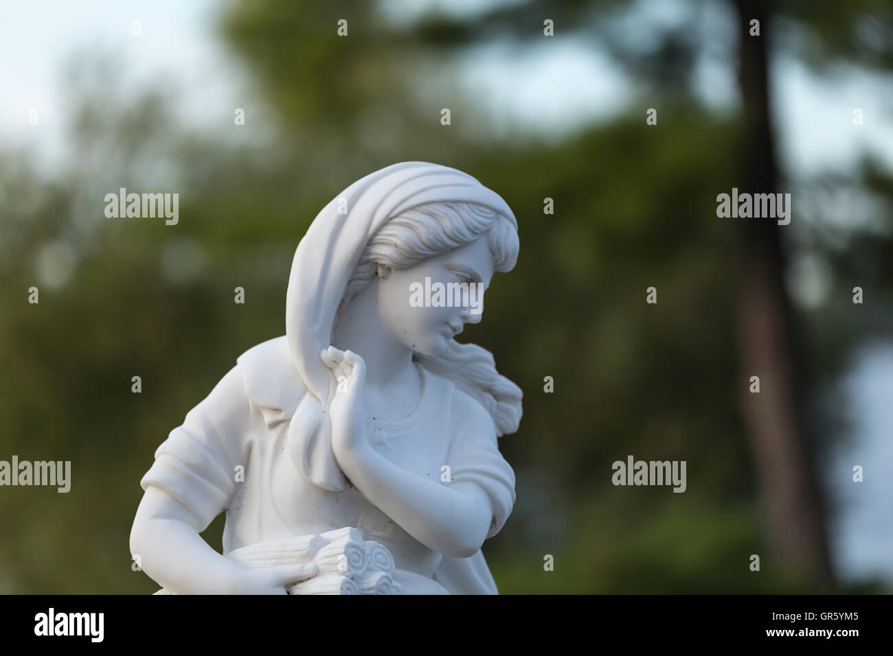 Statue of a beautiful woman in summer Stock Photo - Alamy
