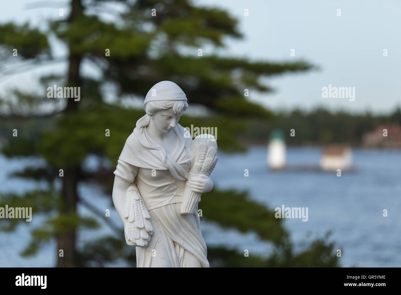 Statue of a beautiful woman in summer Stock Photo - Alamy