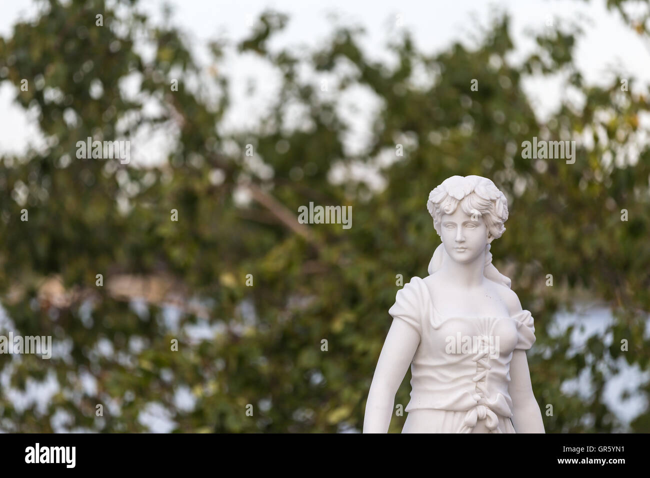 Statue of a beautiful woman in summer Stock Photo - Alamy