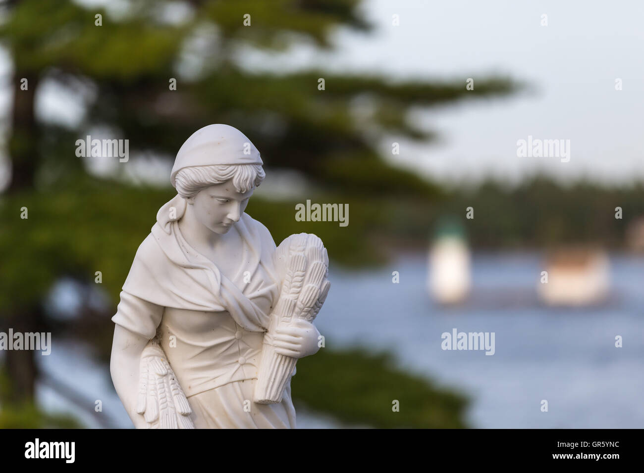 Statue of a beautiful woman in summer Stock Photo - Alamy