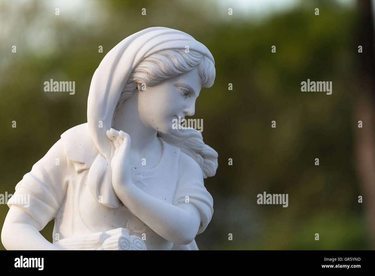 Statue of a beautiful woman in summer Stock Photo - Alamy