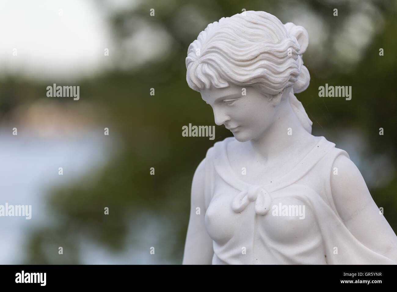 Statue of a beautiful woman in summer Stock Photo