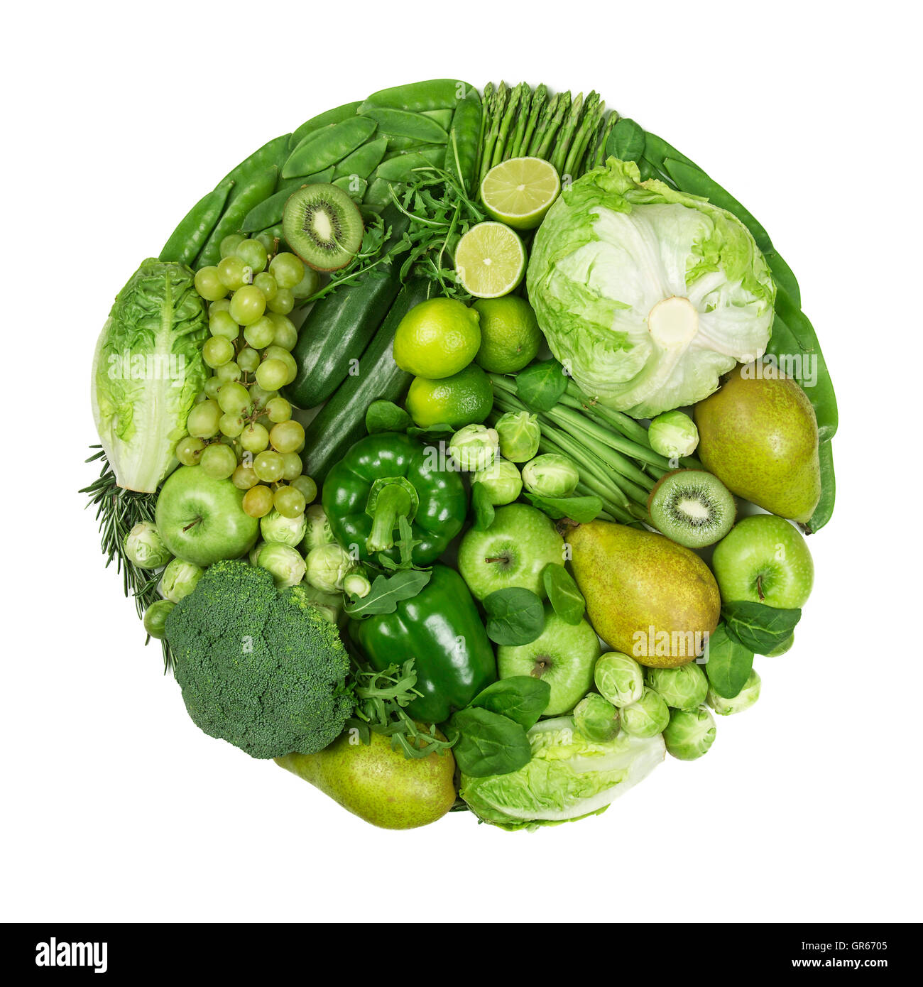 Circle of green fruits and vegetables isolated on a white background Stock Photo