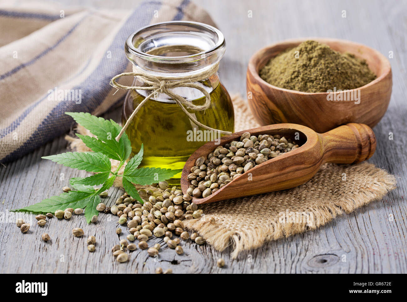 Hemp oil n a glass jar and hemp seeds Stock Photo