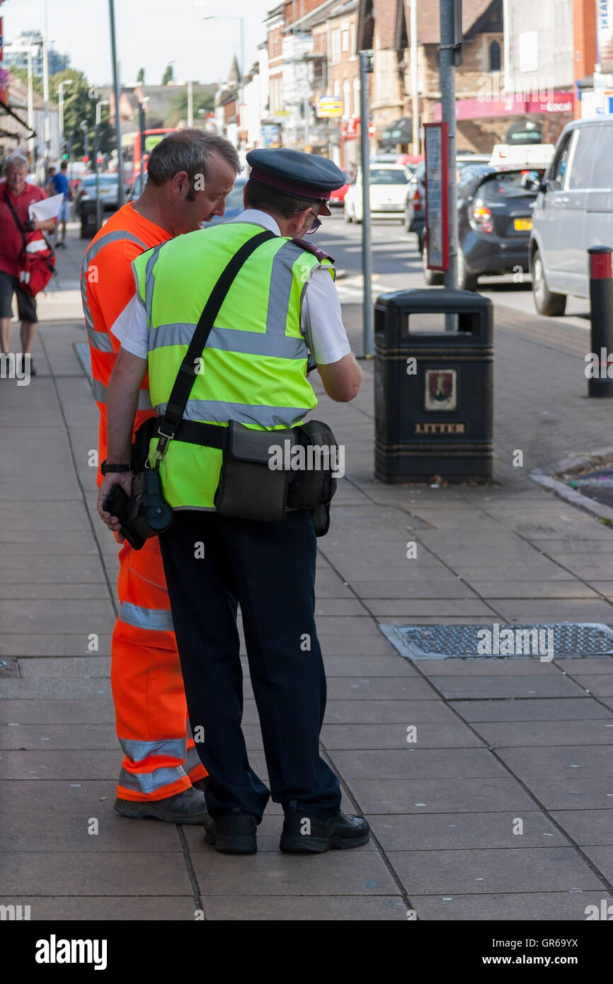 Traffic warden helping with directions Stock Photo Alamy
