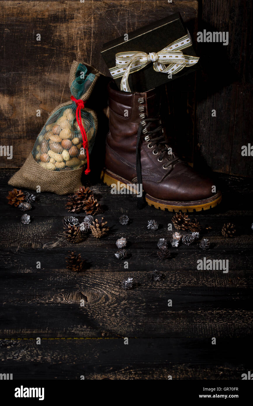 Jute Bag With Different Nuts In Addition To A Winter Boot With Gifts Stock Photo