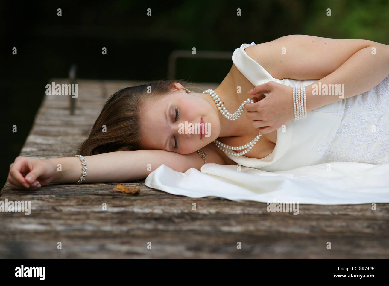 Young Woman In A White Dress Stock Photo