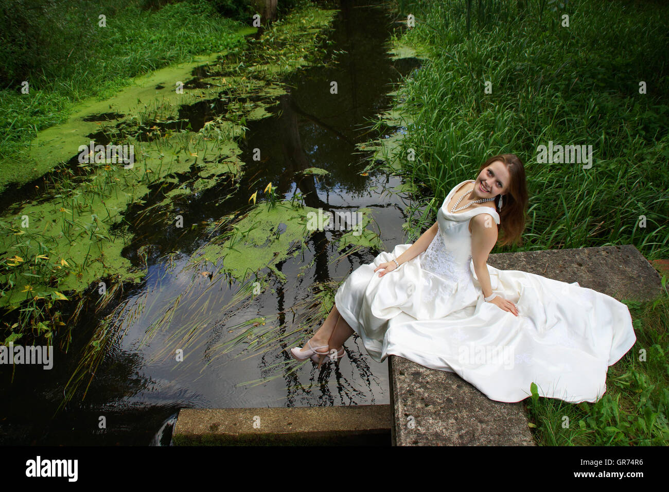 Young Woman In A White Dress Stock Photo
