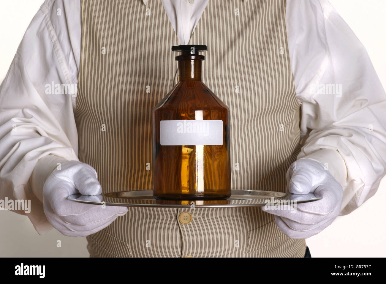Butler With A Medizin-Bottle Stock Photo