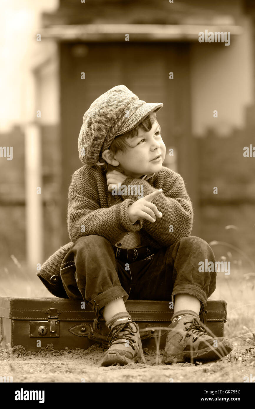 Little Boy Alone On A Railway Station Stock Photo - Alamy