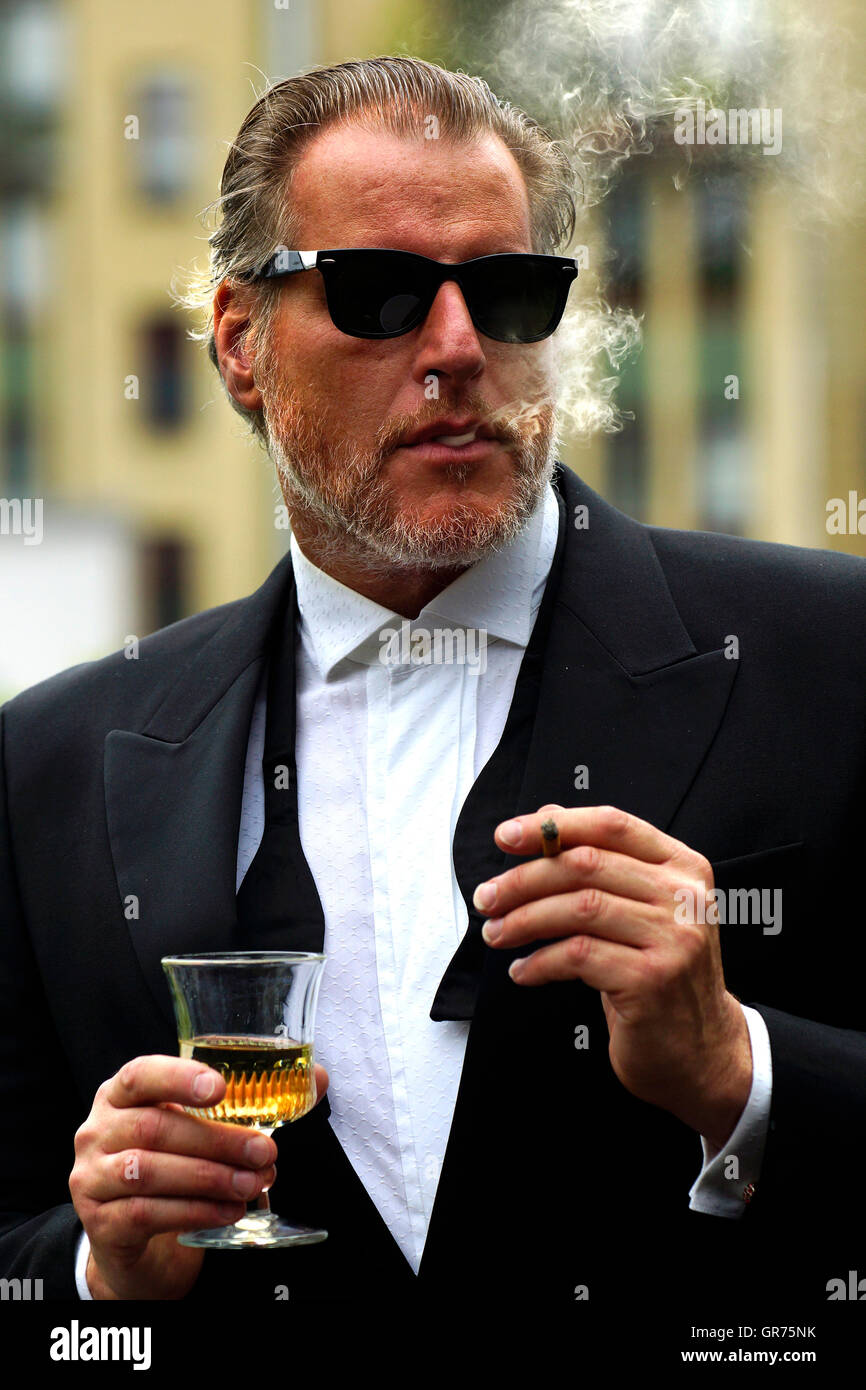 Man With Smoking With A Glass Wine And Cigarette Stock Photo