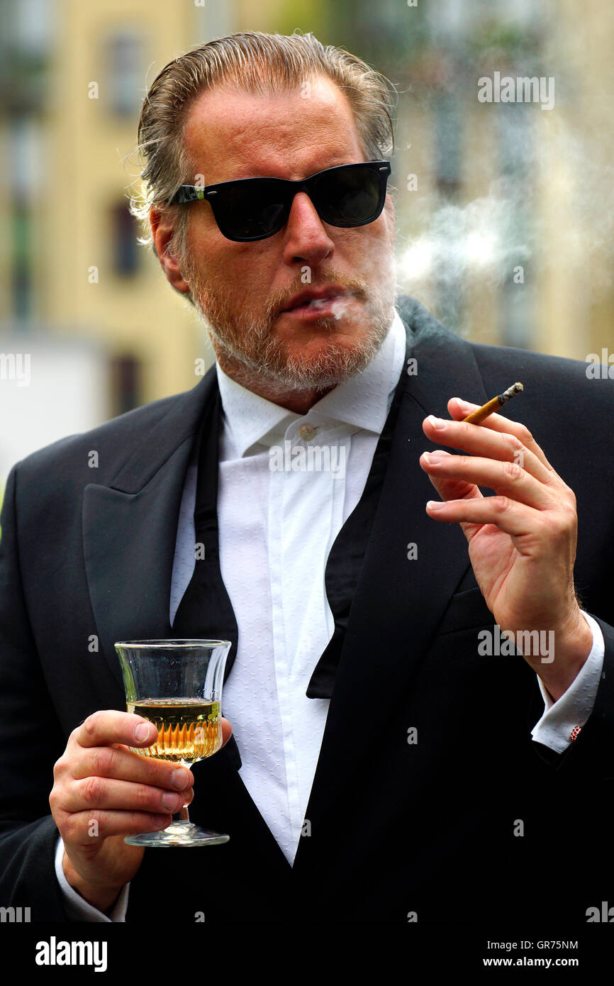 Man With Smoking With A Glass Wine And Cigarette Stock Photo