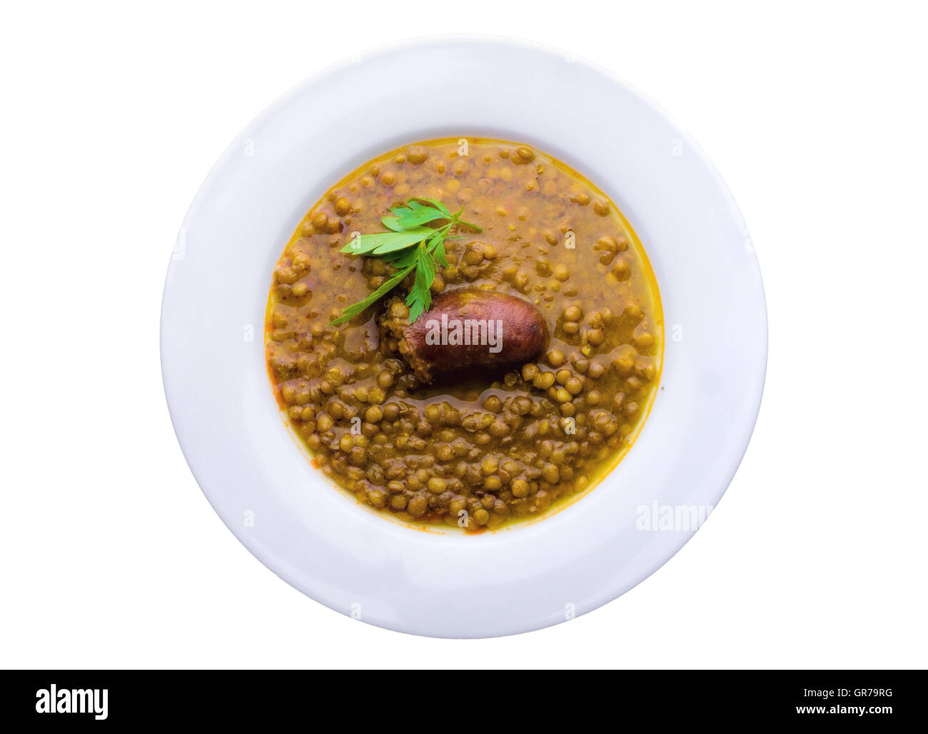 Lentil Soup In A White Plate With Sausage, Isolated On White Stock Photo