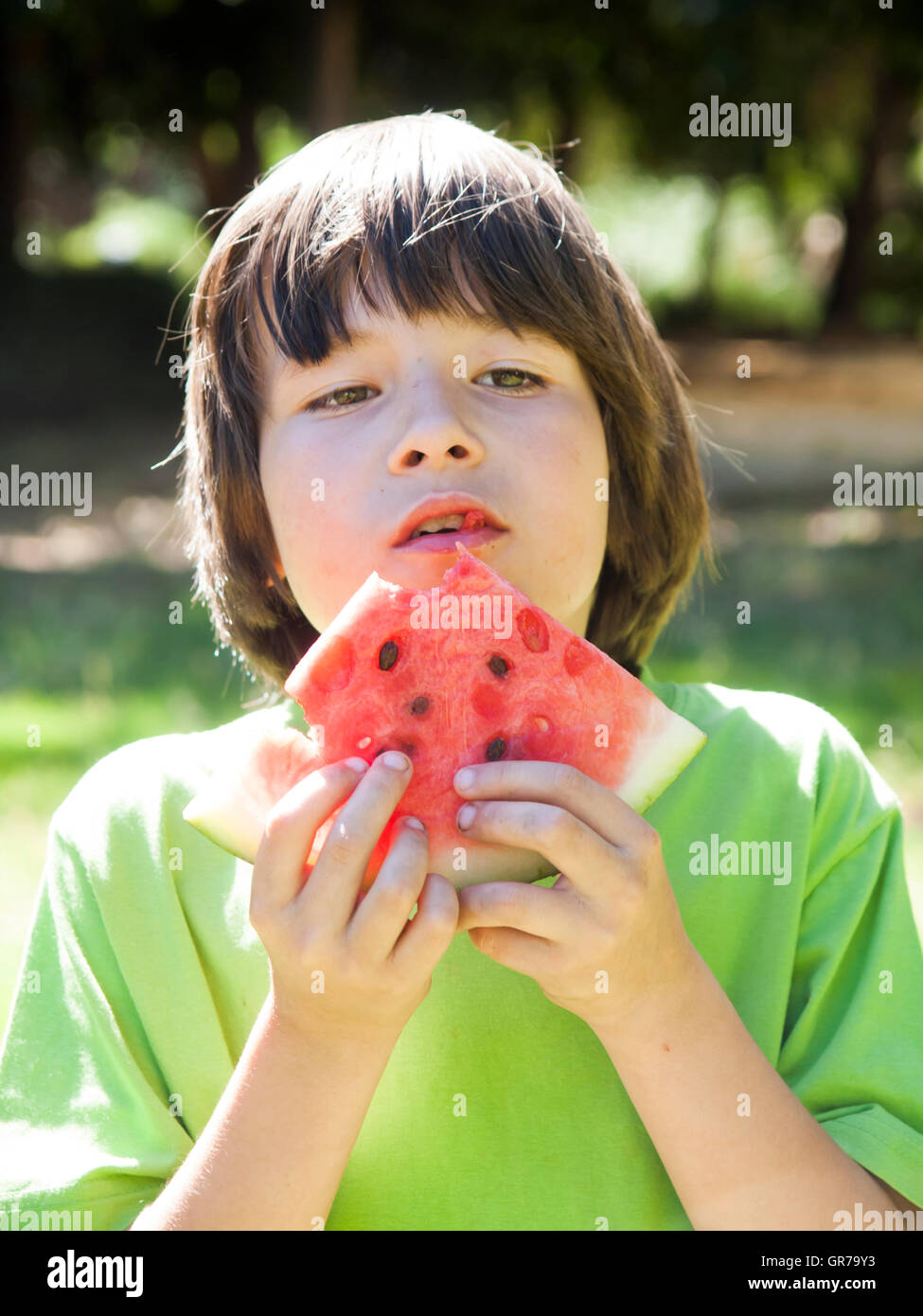 Boy Child Eating Watermelon During Sunny Day Stock Photo Alamy