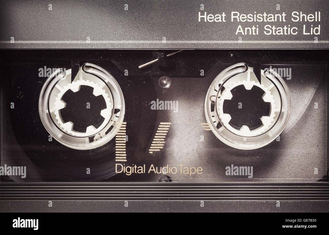 Details of an old dusty digital audio tape, retro technology from the 90's. Stock Photo