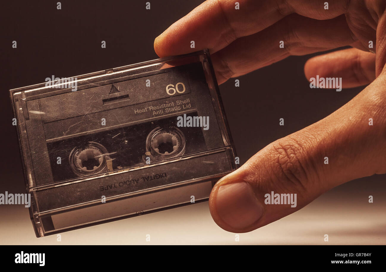 Details of an old dusty digital audio tape, retro technology from the 90's. Stock Photo