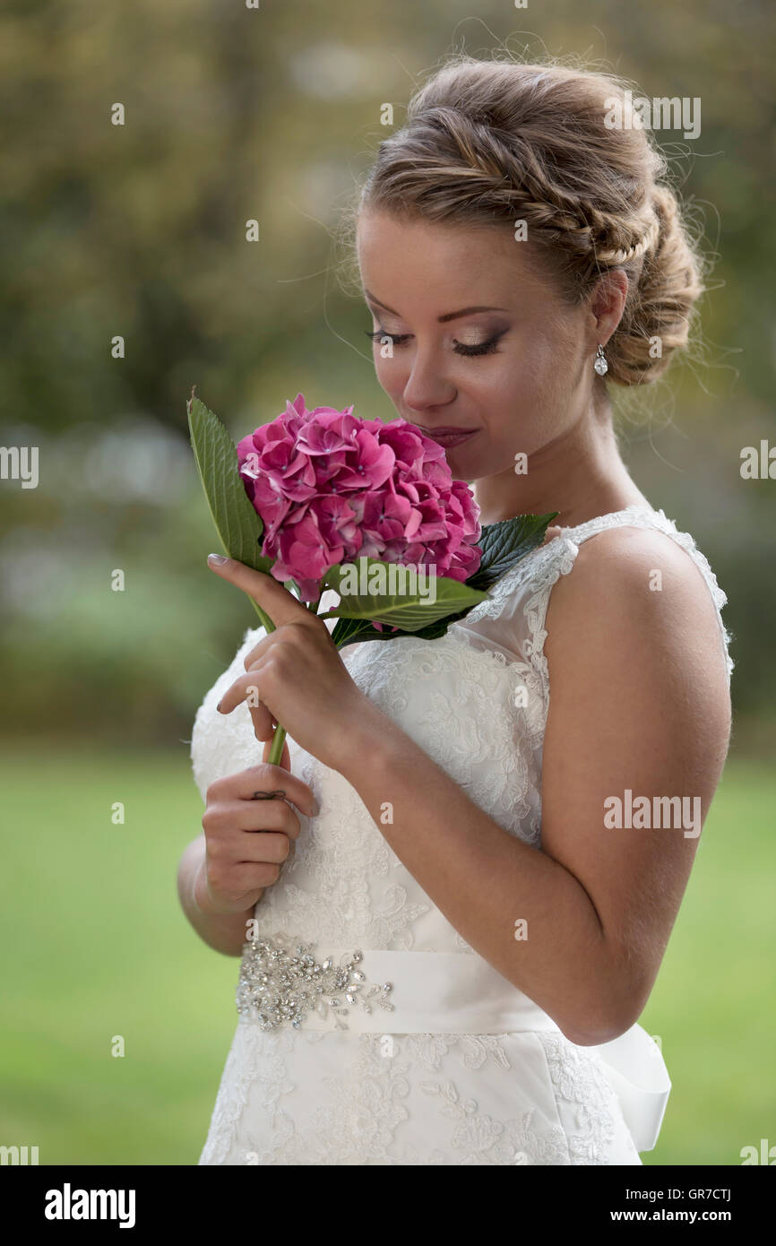 ThreeQuarter Shot Of A Pretty Young Bride In White Wedding Dress Stock