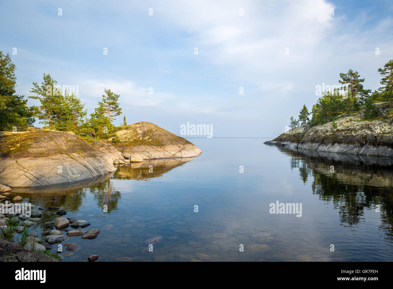 Mirror water and stone shores of Karelia republic islands Stock Photo ...