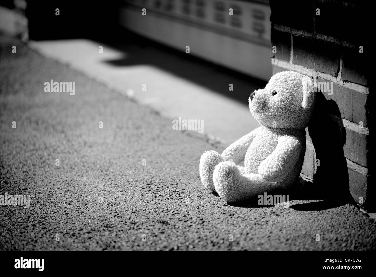 Teddy Bear On The Ground, Childhood Trauma Stock Photo