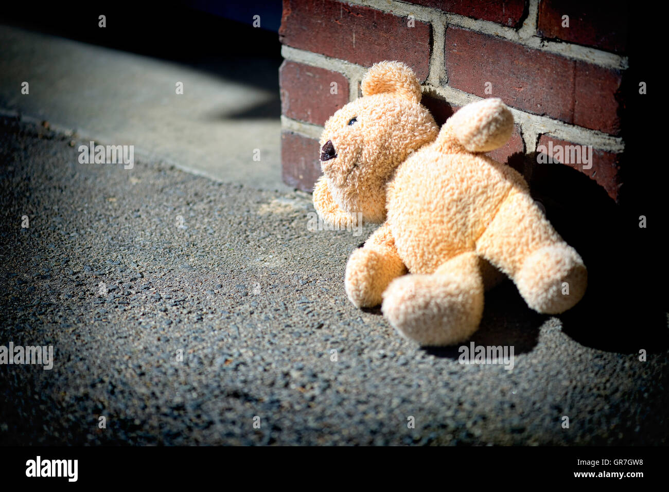 Teddy Bear On The Ground, Childhood Trauma Stock Photo