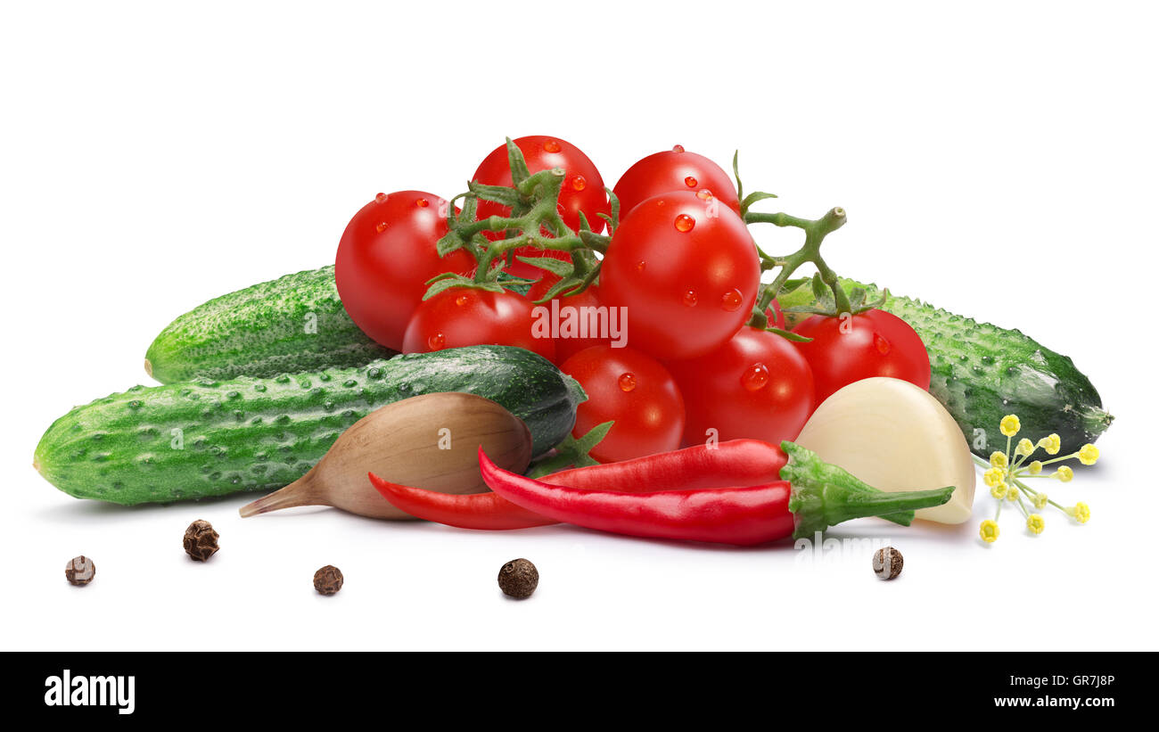 Gherkins (tiny cucumbers or cornichons) with cherry tomatoes for pickling or canning. Clipping path, shadow separated. Design el Stock Photo