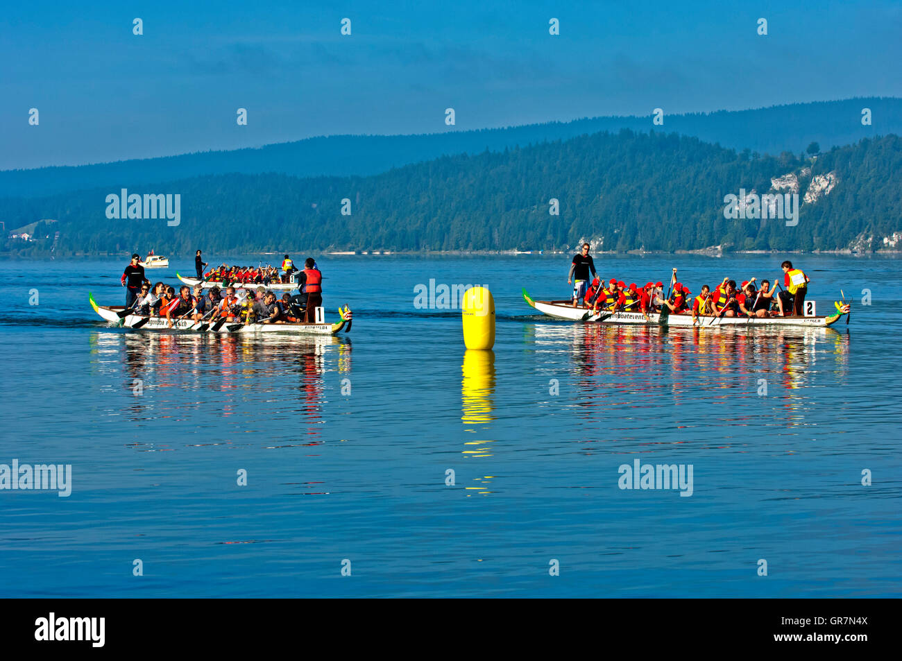 Dragon Boat At The Finishing Line Of A Boat Race On Lake Lac De Joux, Vaud, Switzerland Stock Photo