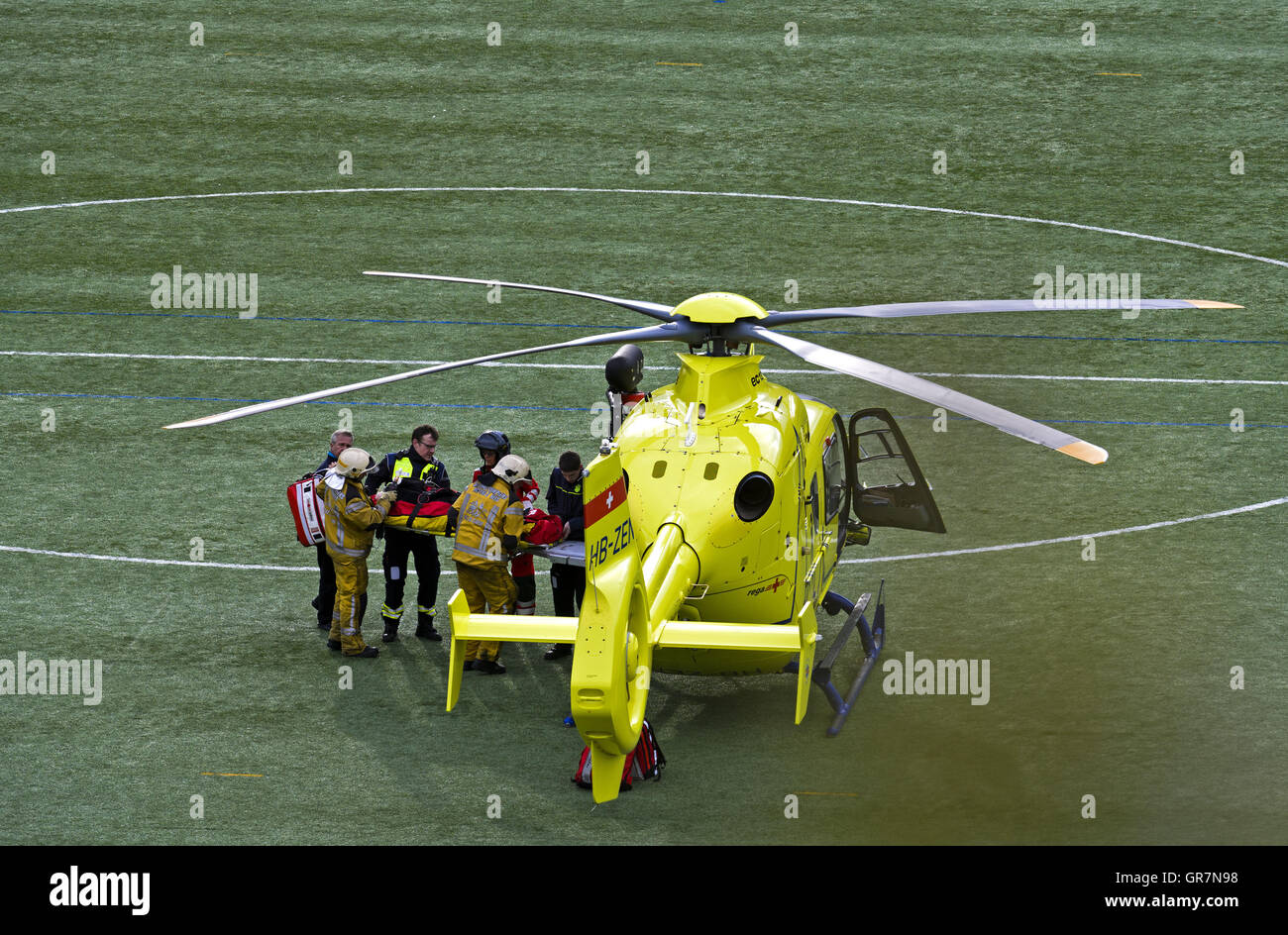 Rescue Workers Carrying A Casualty To A Rescue Helicopter, Geneva, Switzerland Stock Photo