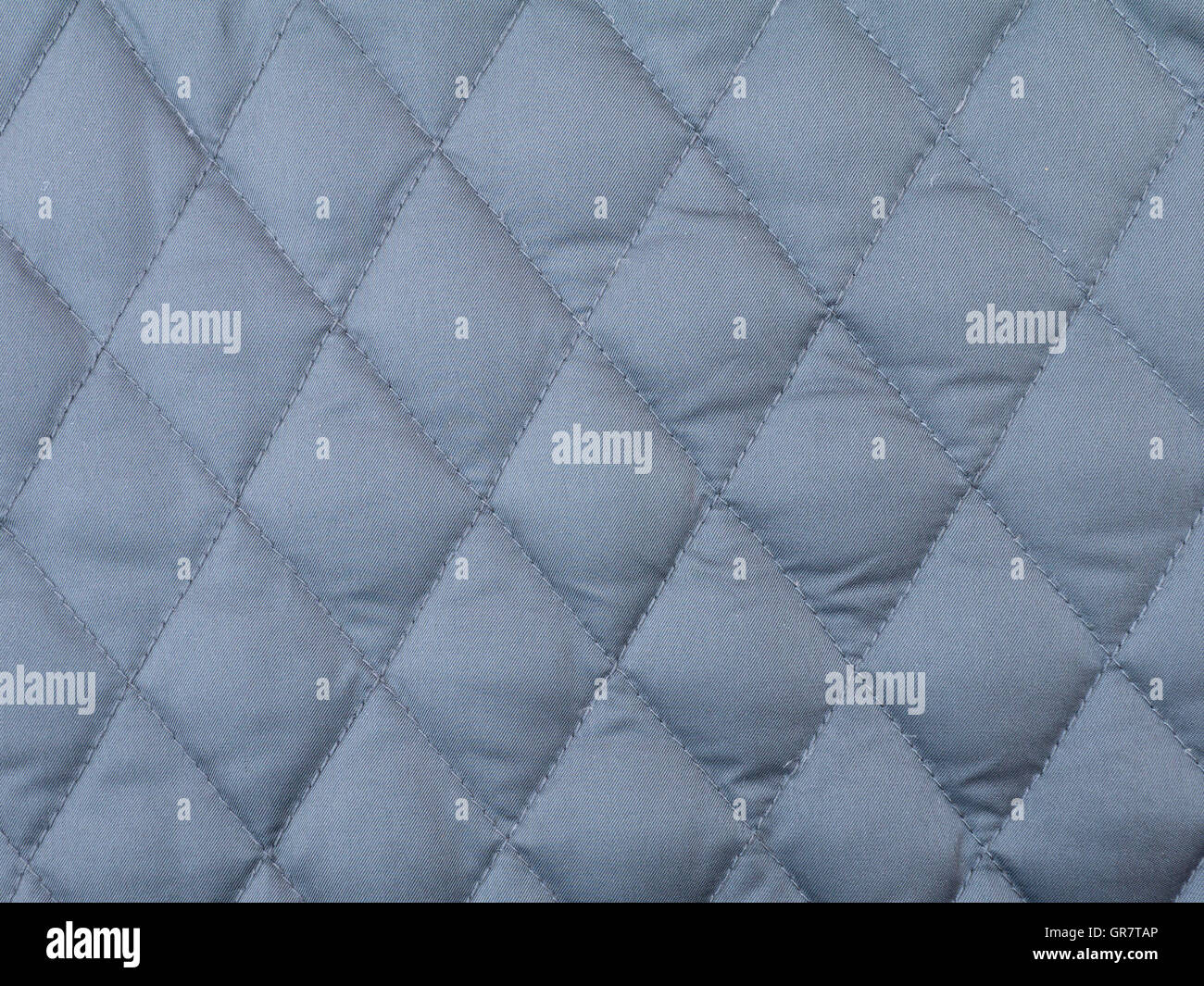 Dark grey rhombus quilted winter cloth background Stock Photo