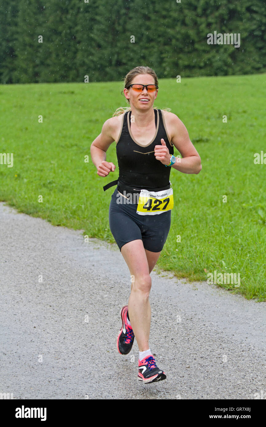 Young Woman Fights At A Triathlon For A Good Ranking Stock Photo