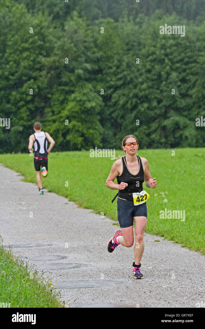 Young Woman Fights At A Triathlon For A Good Ranking Stock Photo
