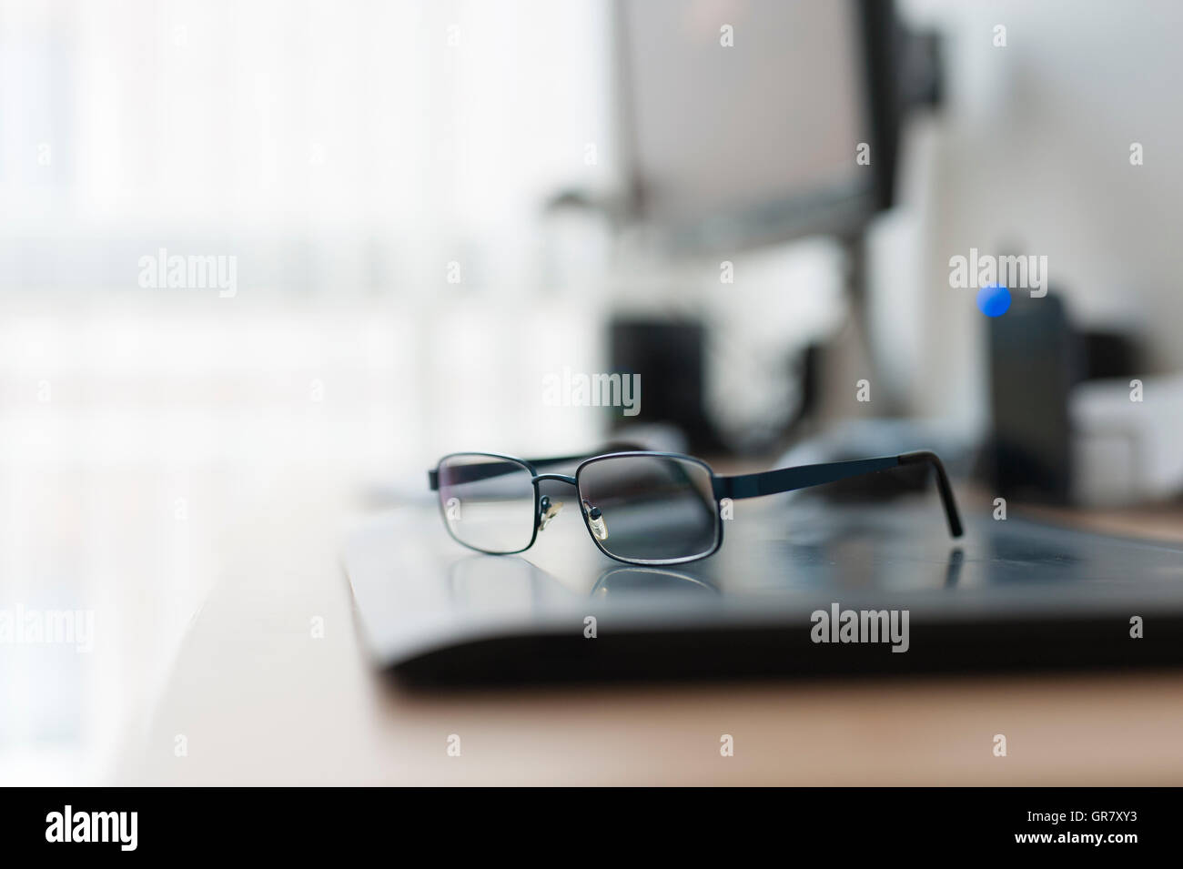 Work Desk With Pc And Glasses Stock Photo