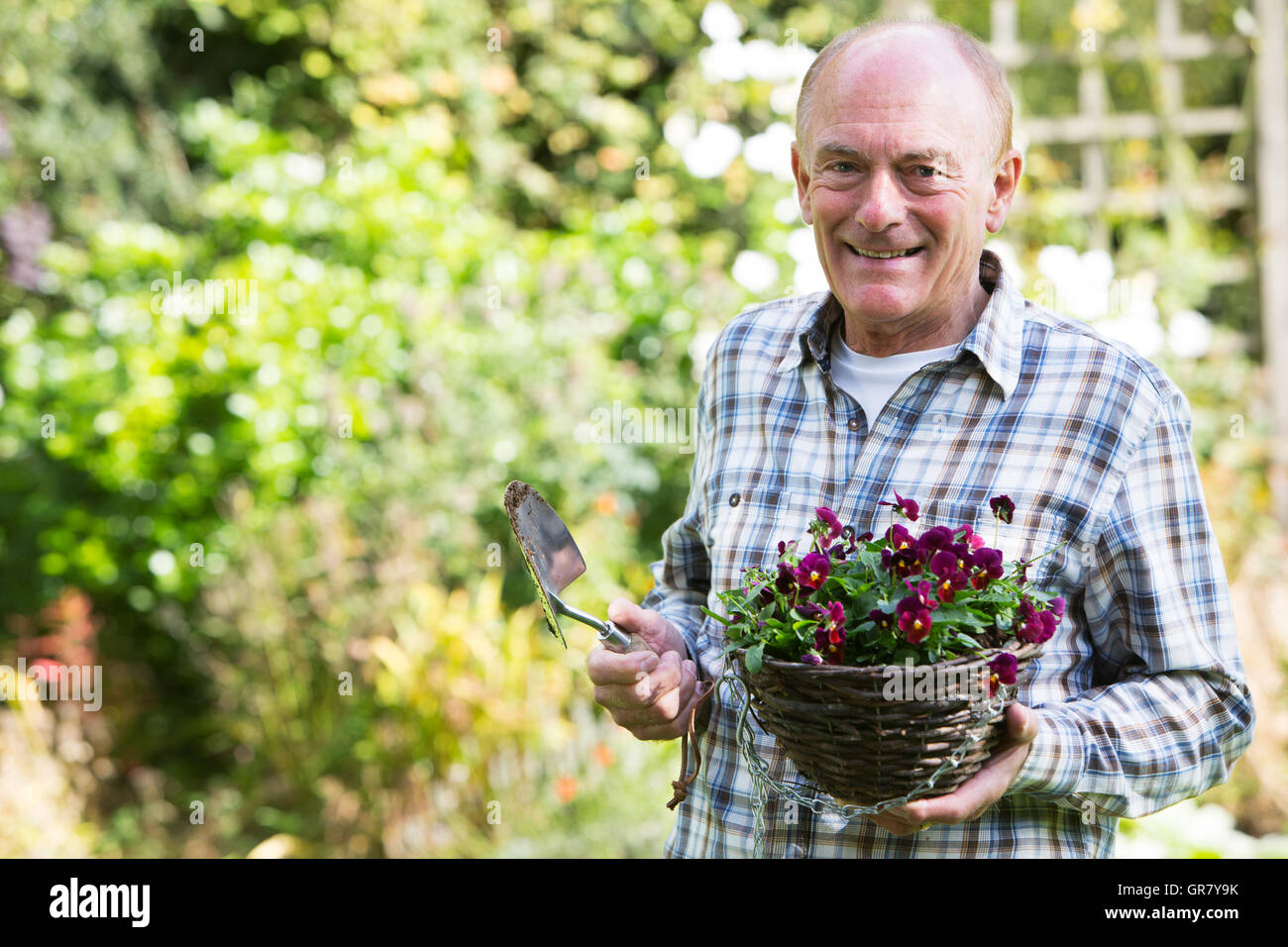 Man garden planting flower hi-res stock photography and images - Alamy