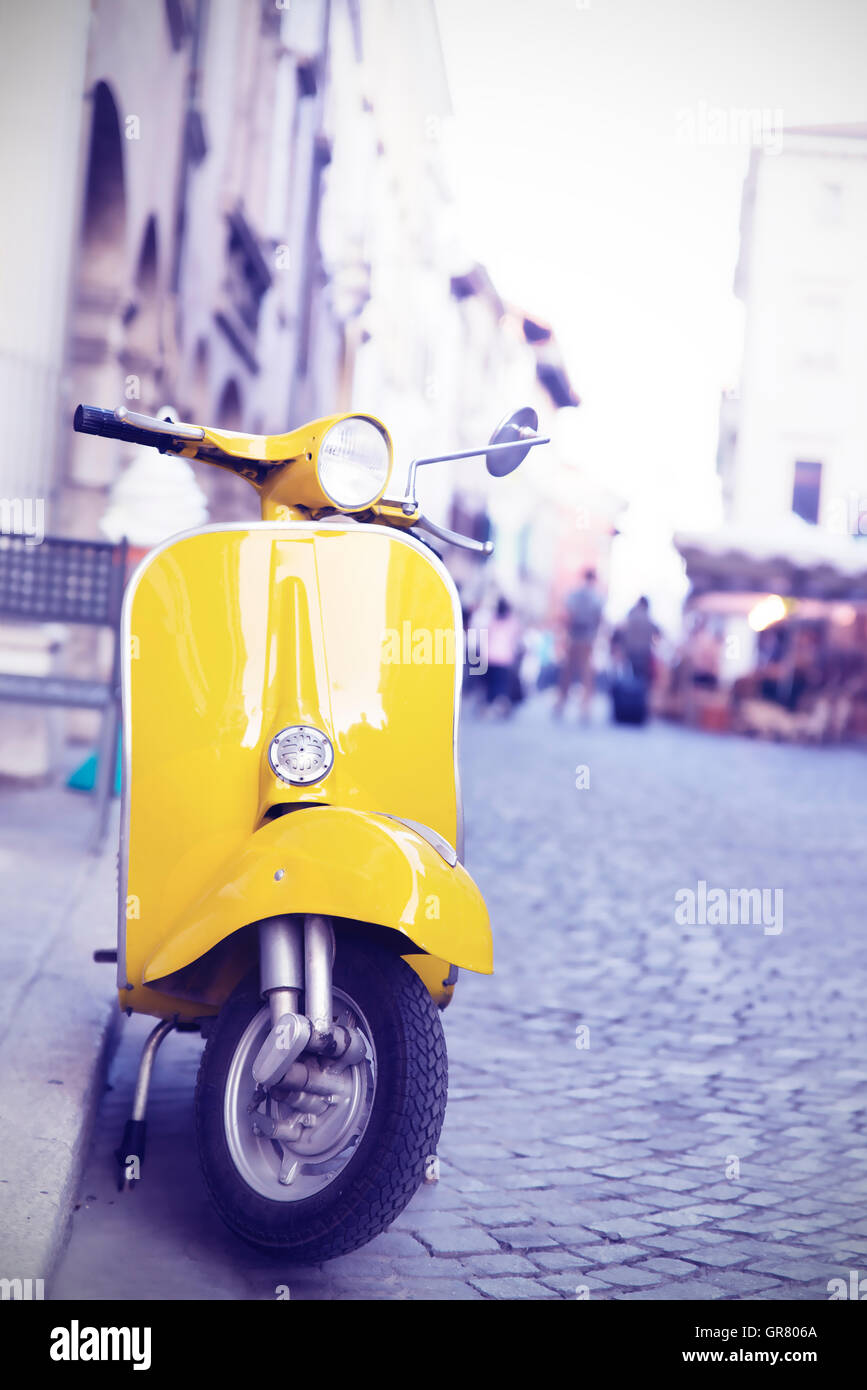 yellow Italian production motorcycle parked in the city Stock Photo